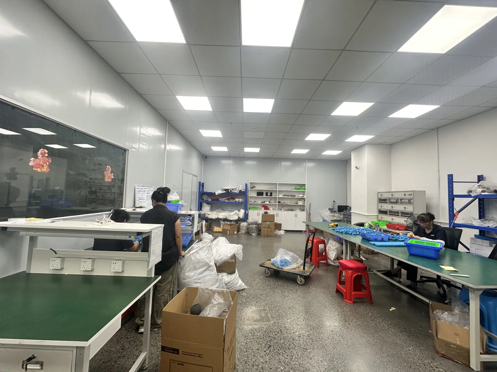 Worktables, staff and shelving in the finishing work area